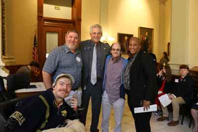 Photo of members of the Diversified Enterprises Team with a Senator